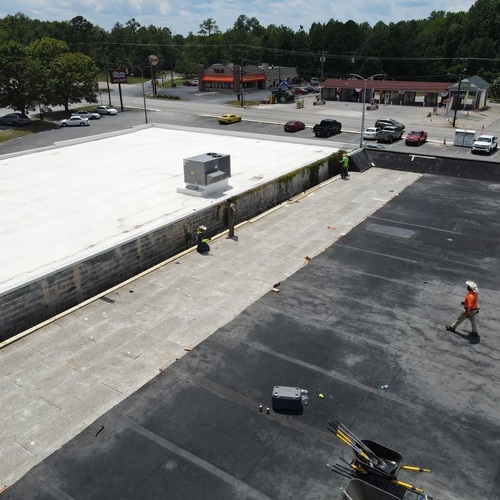 A commercial roofer at work.